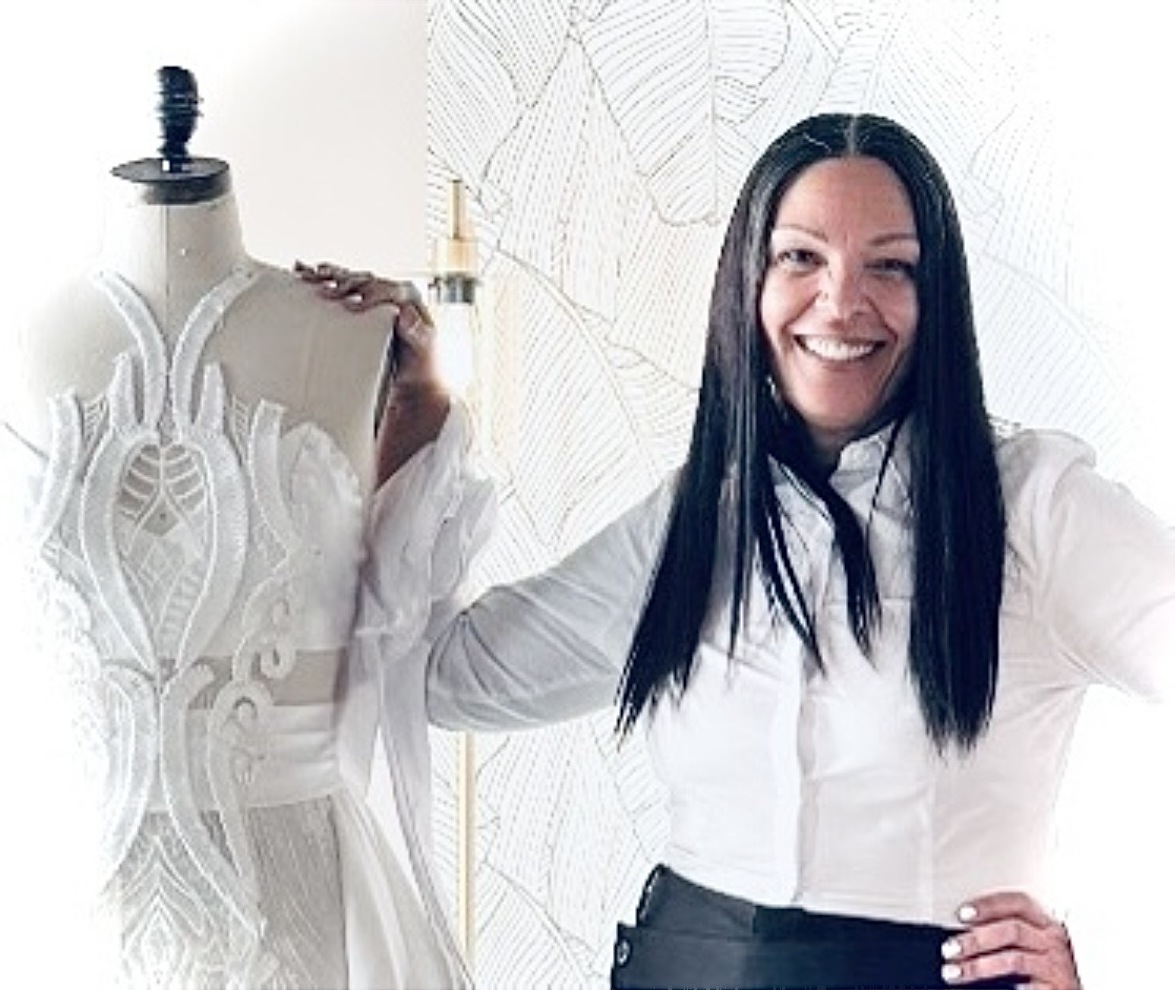 CC.Elaine beside a half-finished gown on a dress form